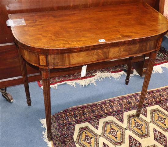 A Regency mahogany D-shaped folding top card table W.90cm